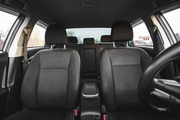 Front Interior View of Modern Car with Black Fabric Seats