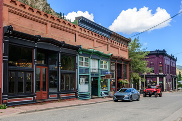 Street of preserved late 1800s architecture buildings with brick facades and painted wood trim. A glimpse into the past during its mining boom days.