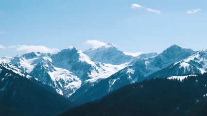 Fototapeta premium Snow-Capped Mountain Range Under a Clear Blue Sky