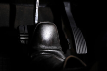 The driver checks the car's brakes every time before a long journey for safety.