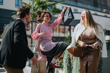Three multicultural business colleagues joyfully celebrate a success in a vibrant urban setting,...