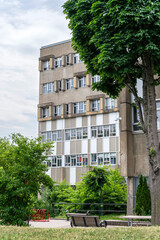 Fototapeta premium An old concrete school on a grey sky