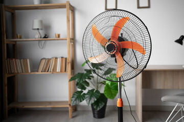 Floor electric fan in the living room. Air cooling