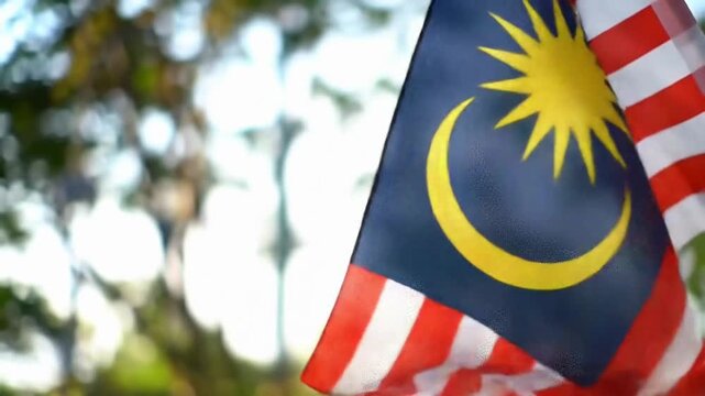 Closeup of the Malaysian Flag Waving in the Breeze.
