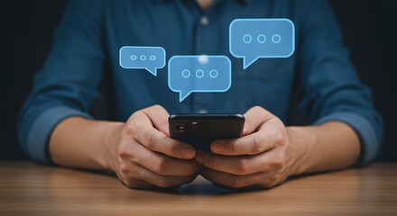 A man holds a smartphone with digital speech bubbles hovering above, suggesting communication and messaging.