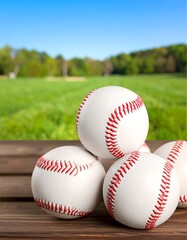 Baseball balls on wooden surface