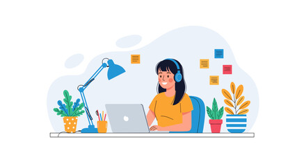 Young woman with headphones happily working on a laptop at a desk with plants and a lamp, illustrating remote work or online learning.