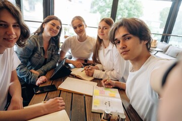 Making selfie. Group of young friends are in the cafe restaurant