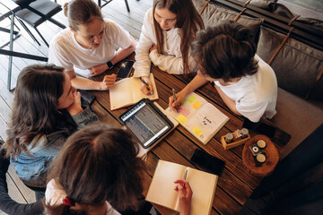 Top down view. Group of young friends are in the cafe restaurant © standret