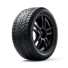 Obraz premium Black tire on a dark-colored wheel, isolated on white