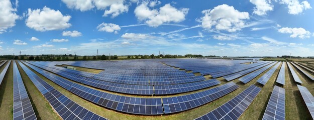 Aerial drone view of photovoltaic solar power plant panels in Nottingham england UK sunny day electrical energy  © Liam Carter