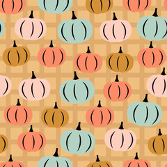 Seamless pattern with hand drawn pumpkin in cartoon style on cell background
