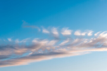 Obraz premium Soft pastel clouds in bright blue sky during peaceful daylight