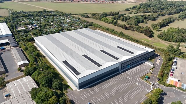 Aerial drone shot of new warehouse business district and distribution centre in Nottingham England UK