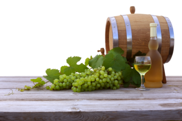 Green grapes, barrel, bottle of white wine and glass on a wooden table cutout.