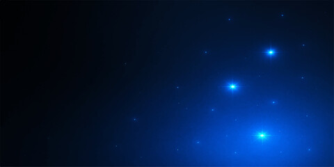 Obraz premium Abstract starry night sky with glowing blue particles and a cosmic dust nebula