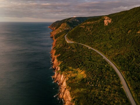 winding road through the forest . View from top of a cliff. Nova scotia canada.