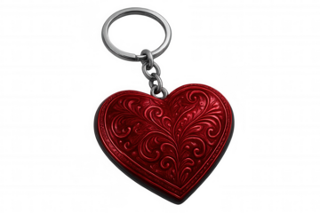 Metallic red heart keychain with delicate floral design, dangling elegantly on clear surface, symbolizing love and affection