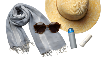 Stylish summer essentials including a straw hat, sunglasses, scarf, and sunscreen for a perfect vacation getaway. Isolated on white background 