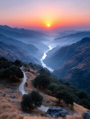 Golden Sunrise Illuminates Misty Himalayan Valley with Winding River and Path