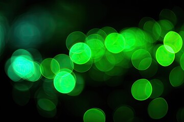 Abstract bokeh lights, vibrant green circles on black background (1)