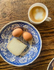 Rustic blue floral china hosts farm-fresh breakfast dreams, celebrating Ostara's renewal with caffeine whispers and artisanal simplicity