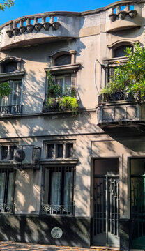 Sun-dappled art deco facade whispers Buenos Aires nostalgia, perfect for Dia del Amigo reflections or eccentric architectural tours