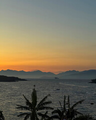 Tropical dusk kisses the ocean horizon, whispers of Aloha Festivals and Pacific Rim cultural...