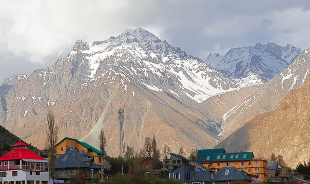 beautiful mountain village jispa, on bank of bhaga river and surrounded by snowcapped himalaya mountains in lahaul valley, himachal pradesh, india