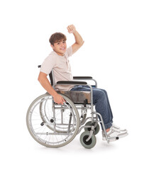 Obraz premium Smiling teenage boy in wheelchair on white background