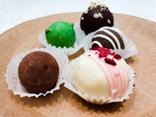 Round candy balls, chocolate candies close-up.