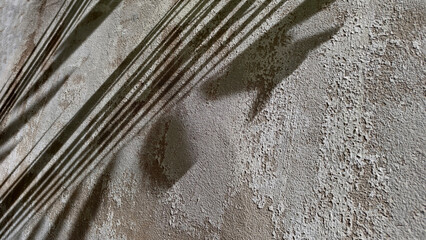 close-up rough weathered texture old cement wall with peeling, cracked white paint. Wall surface...