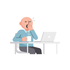 Tired bald man in a blue shirt yawning at his desk holding a steaming coffee mug.
