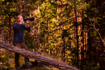 Photographer in woodland