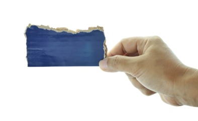 Female hand holding shredded paper isolated on white background.