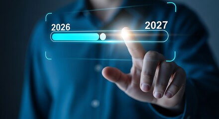 Hand interacting with digital progress bar from 2026 to 2027 with glowing indicator future advancement