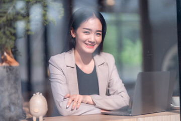 Asian freelance people business female talking making using casual working with laptop computer and...