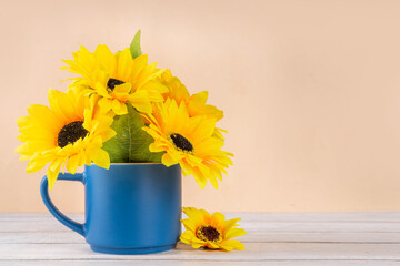 Hello autumn fall seasonal and holiday background, with a bouquet of sunflower flowers, plaid and...