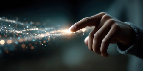 Hand Touching Glowing Light Particles in Abstract Scene