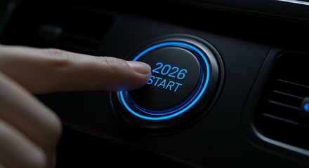 Close-up finger pressing illuminated 2026 start button with glowing blue circular interface for new year activation
