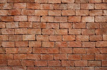 Naked orange brick wall surface. Brick texture background for design, wallpaper construction building.