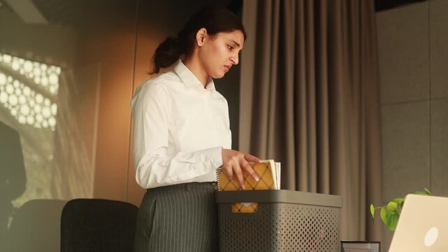 A sad Woman get fired in the Task of Organising Office Supplies with bad Emotion and Focus