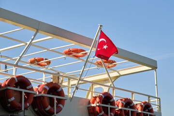 Turkish Flag on Ship with Life buoys