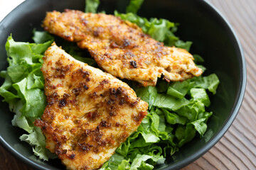 fried chicken with salad vegetables close up