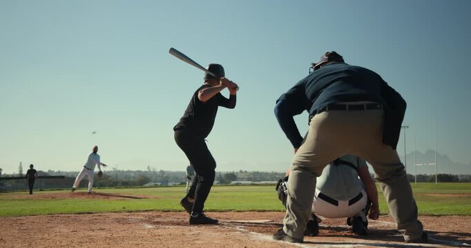 Male players after catcher signal at home plate, pitcher winding up, batter swinging aluminum bat