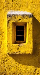 Yellow wall with recessed window