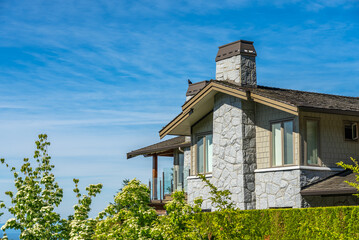 Top of luxury house with shingle roof and nice windows in Summer in Vancouver, Canada, North...