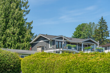 Top of luxury house with shingle roof and nice windows in Summer in Vancouver, Canada, North...
