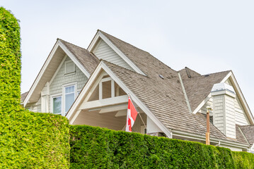 Top of luxury house with shingle roof and nice windows in Summer in Vancouver, Canada, North...