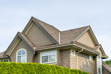 Top of luxury house with shingle roof and nice windows in Summer in Vancouver, Canada, North...